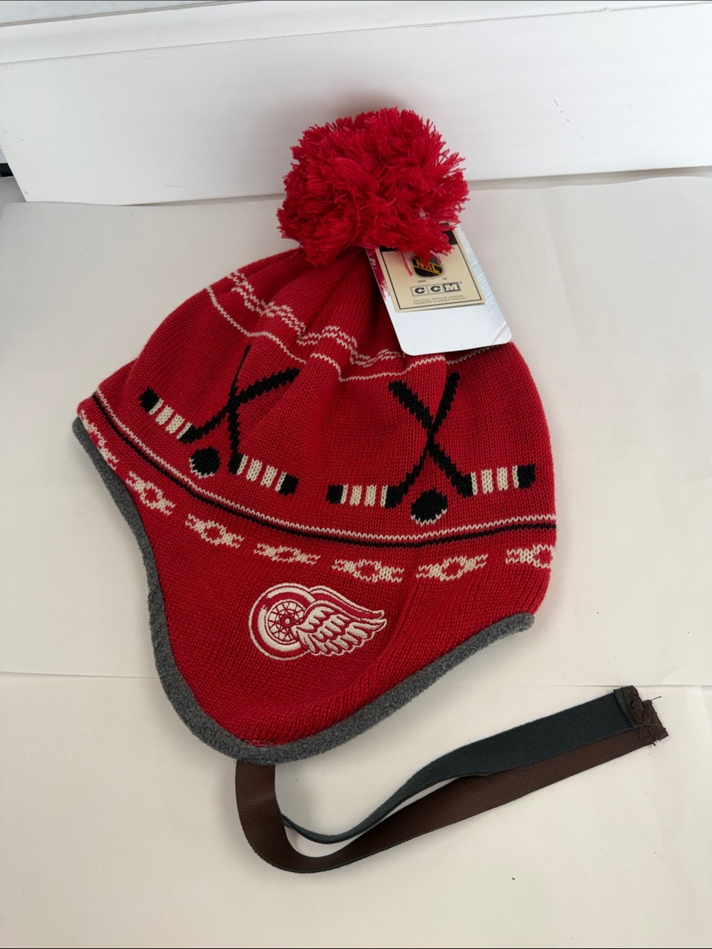 NWT (New With Tags) CCM "Team Classics" Detroit Red Wings earflap knit pom hat